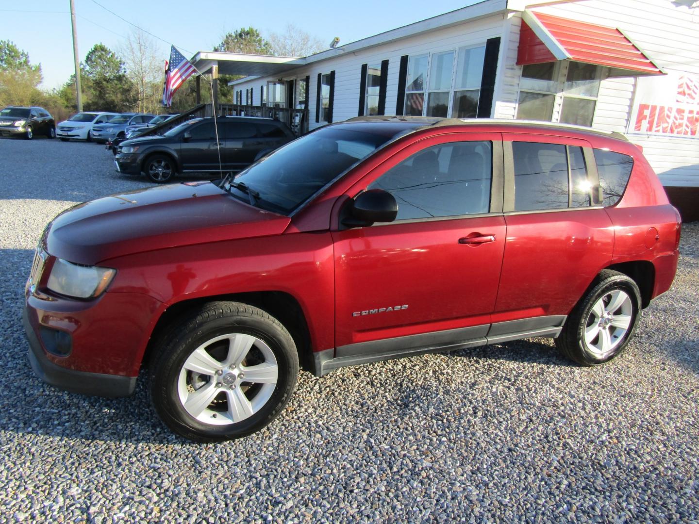 2016 Red /Gray Jeep Compass Sport FWD (1C4NJCBA3GD) with an 2.0L L4 DOHC 16V engine, Automatic transmission, located at 15016 S Hwy 231, Midland City, AL, 36350, (334) 983-3001, 31.306210, -85.495277 - Photo#2